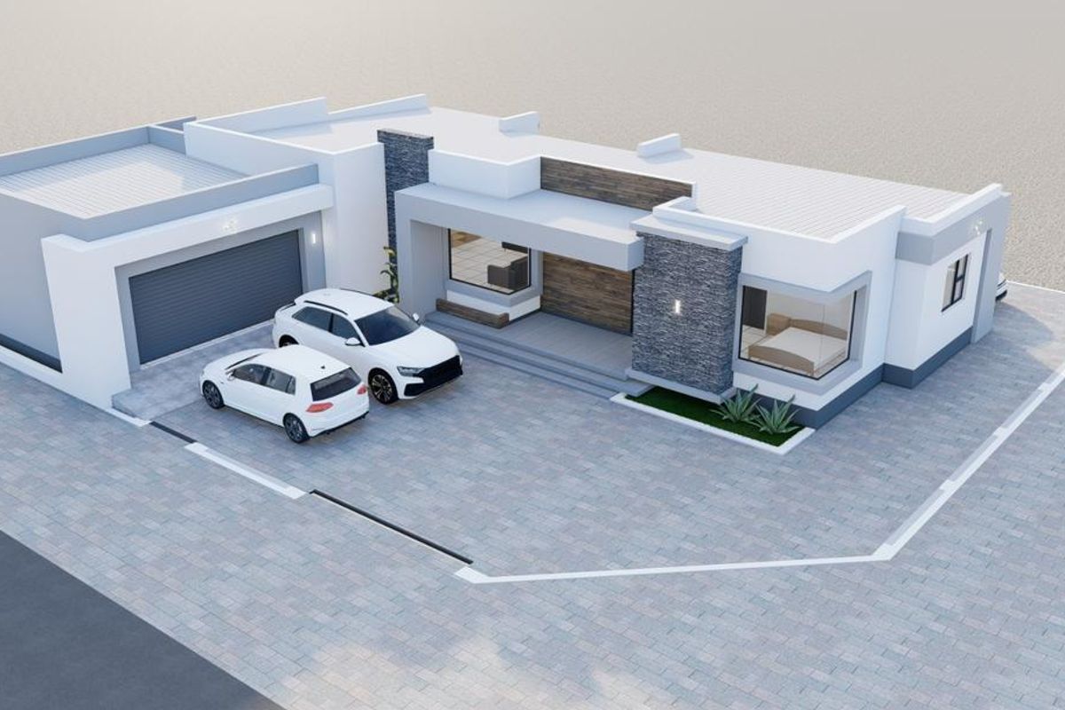 An aerial view of a modern residential property featuring a paved driveway, attached garage, and contemporary architectural design with stone accents.