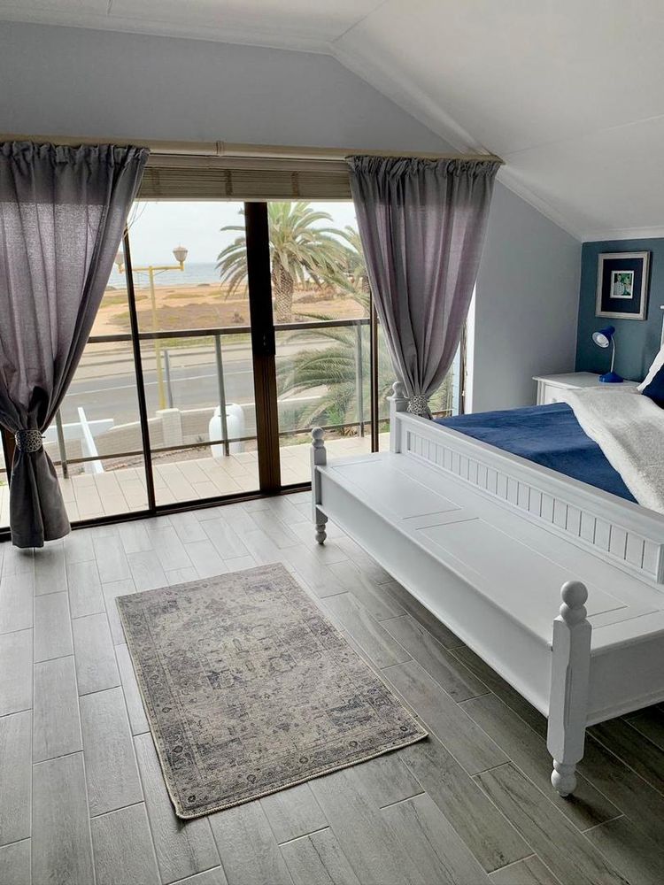 Main bedroom that overlooks the ocean. Soft waves can be heard