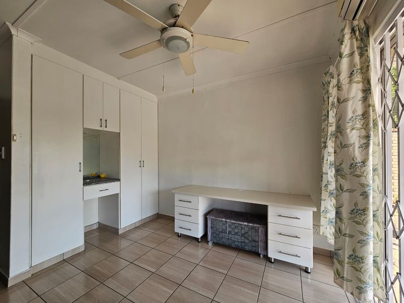 Four-Bedroom Family Home with Pool and Braai in Arboretum - Photo 10