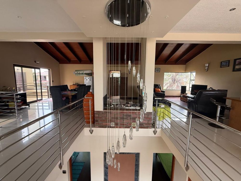 Decorative balcony viewing to the ground floor, as well as a fireplace