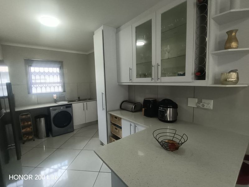 1. "Discover Your Dream Home in Mackenzie Palms!" 2. "Luxurious Living Awaits in This 3-Bedroom Gem!" 3. "Modern Comfort Meets Security in Mackenzie Palms!" 4. - Photo 9