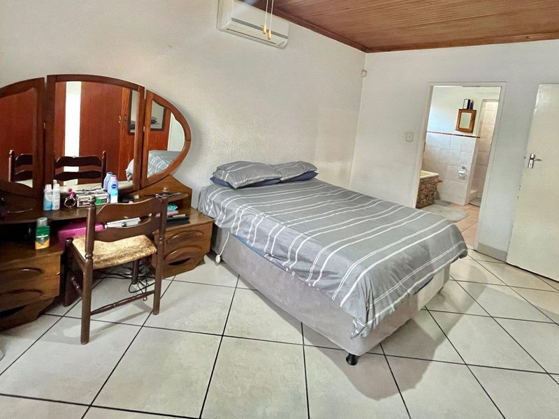 "Elegant Face Brick Home with Modern Security and Ample Parking! - Photo 6