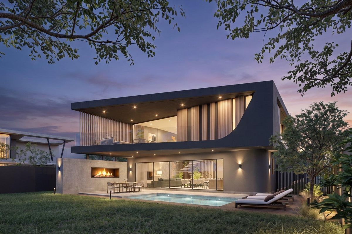 Modern two-story residence featuring a rear patio with a built-in fireplace, swimming pool, and expansive sliding glass doors opening to the living area.
