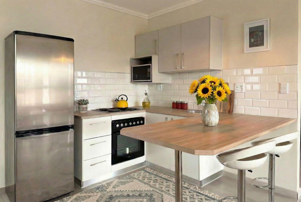 Modern kitchen with plenty of cupboards and separate, kitchen scullery.