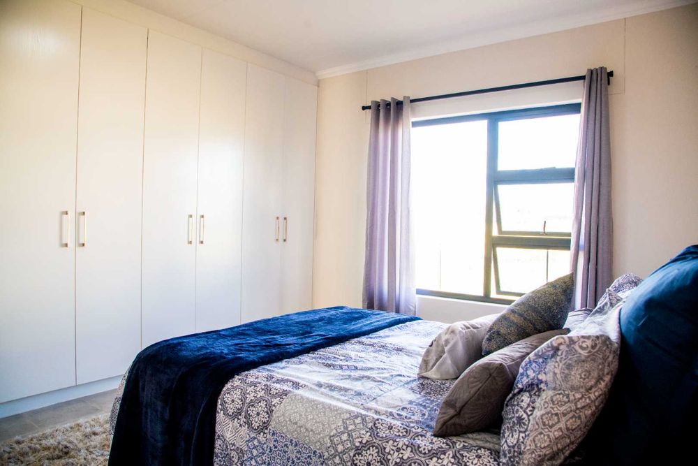 Main bedroom with built-in cupboards & ensuite.