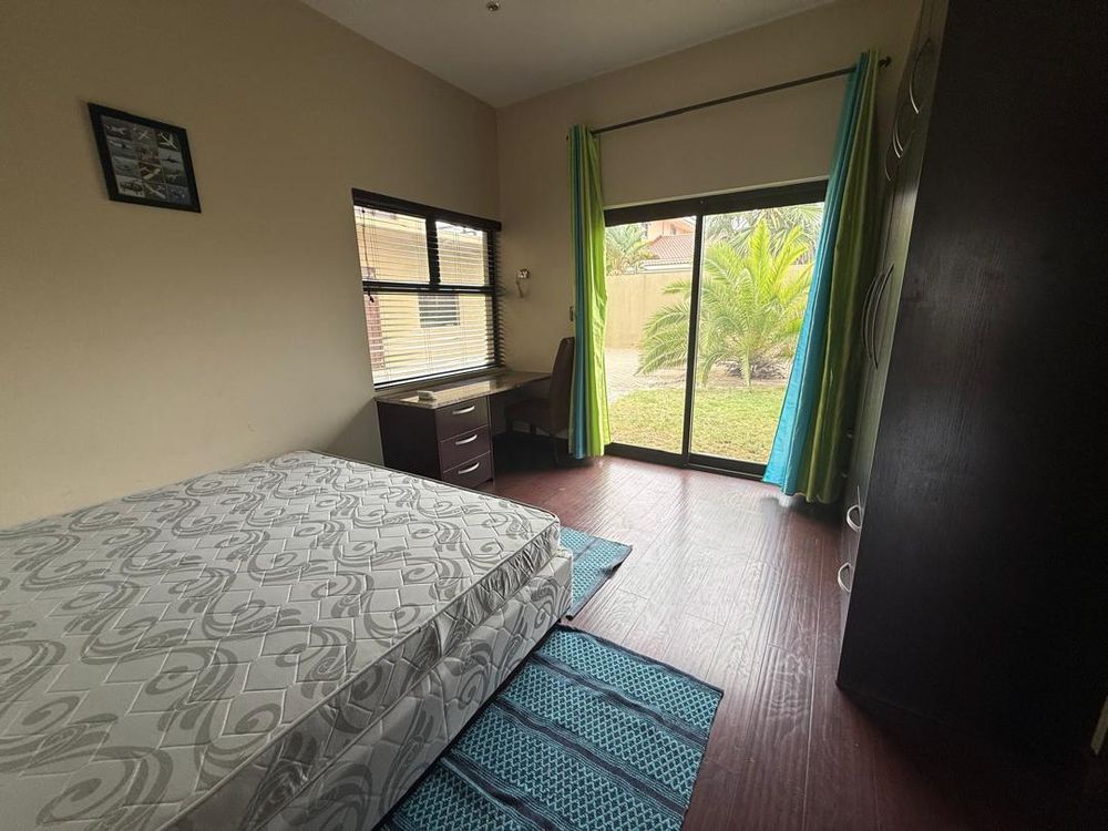 Ground floor, bedroom three, built-in cupboards and shared bathroom