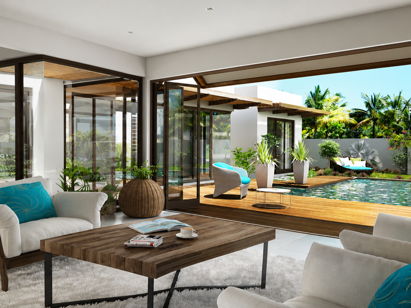 A bright open-plan living area featuring large sliding glass doors that open onto a wooden deck with a swimming pool.