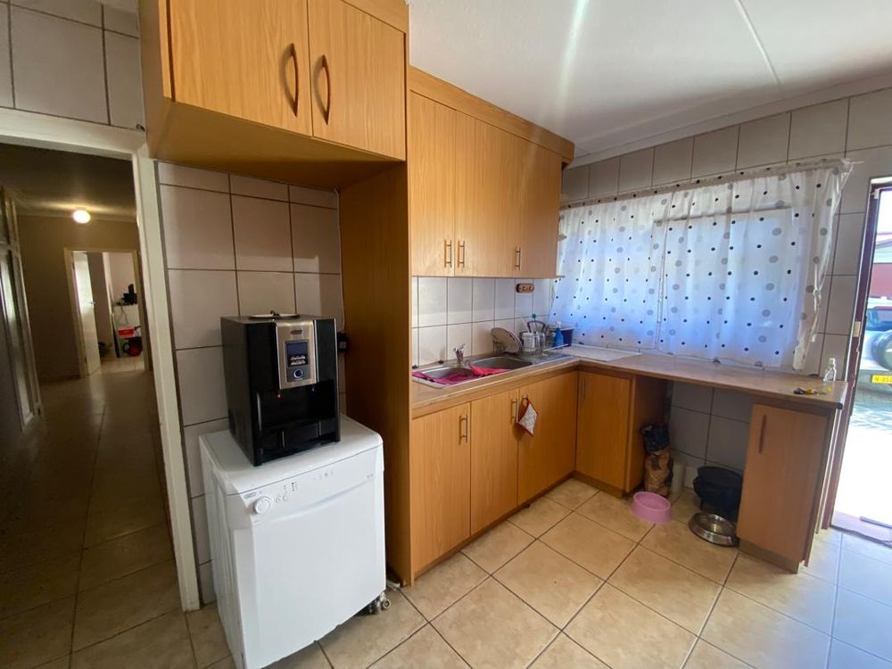 Kitchen with BIC. Left is a hallway leading to the bedrooms