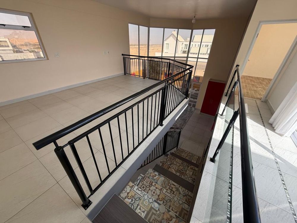 First floor living area, on the right is the main bedroom