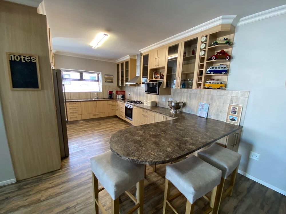 Kitchen with built-in cupboards and oven