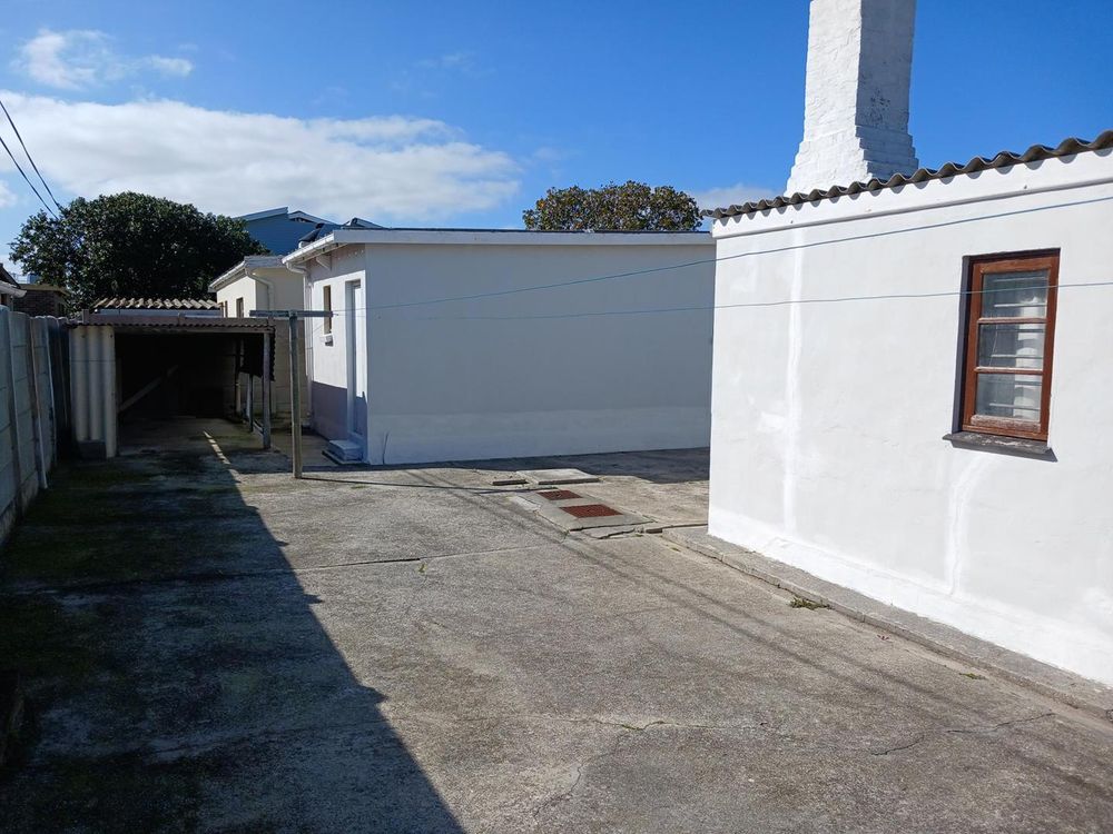 Garage at the back (with an under roof Area on its left) - with Study on our right.