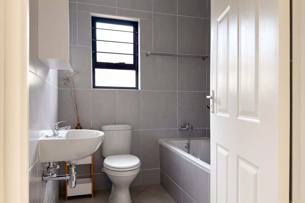 Family bathroom with bath.