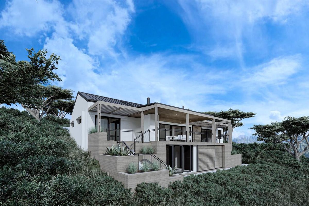 A modern architectural rear elevation featuring a spacious covered patio, timber pergola, and tiered retaining walls set against a natural landscape.