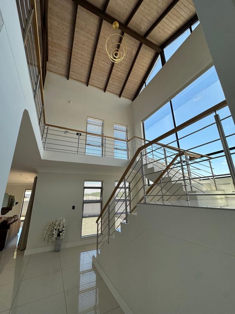 Stairs leading to living area and bedrooms upstairs