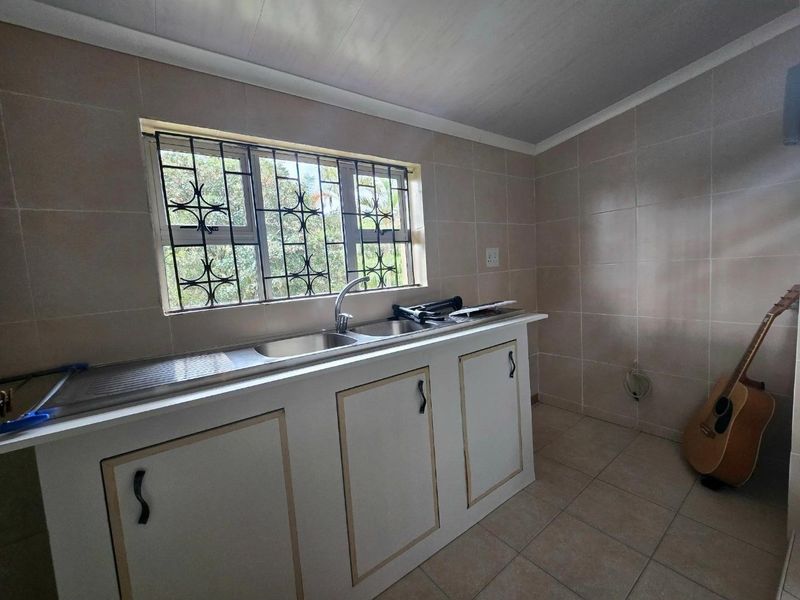 Spacious Four-Bedroom Family Home with potential Flatlet and Scenic Views - Photo 5