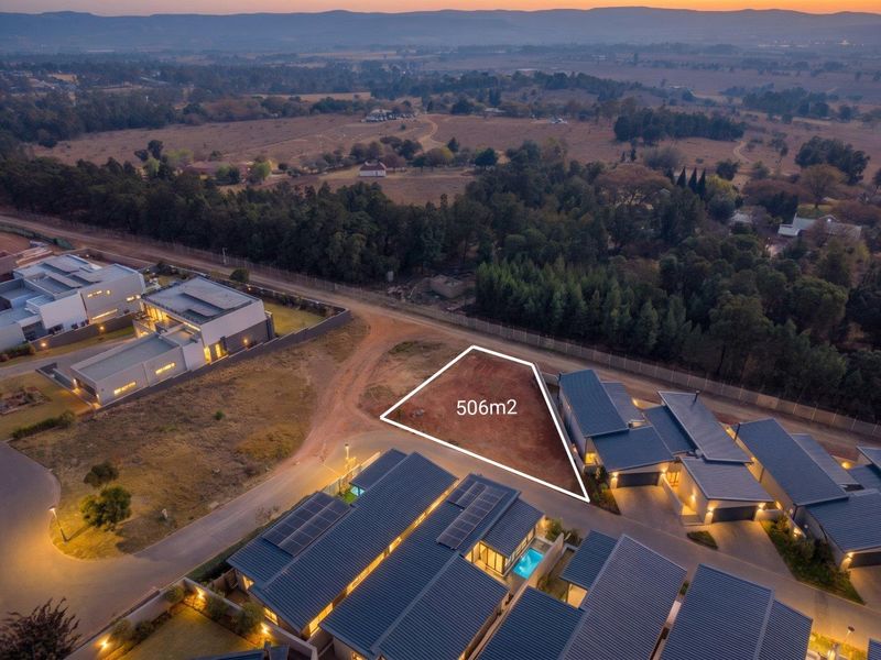 An aerial view of a 506m2 vacant residential plot situated within a developed estate, highlighting the available building footprint.