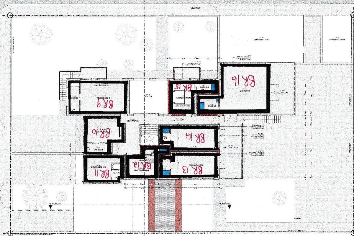 Architectural floor plan layout showing the configuration of multiple bedrooms and en-suite bathrooms within the guest house property.
