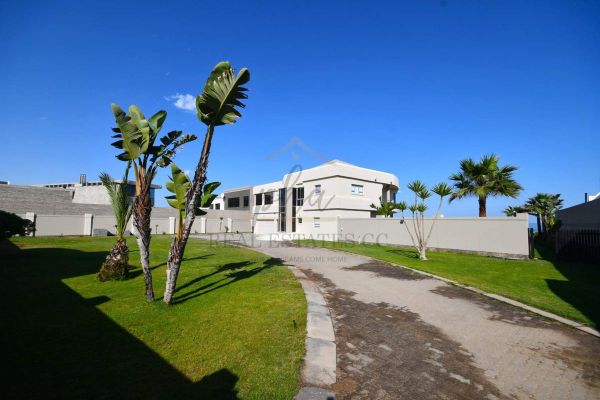 Exceptional Double-Story Beachfront Home with Unobstructed Sea Views - Photo 2