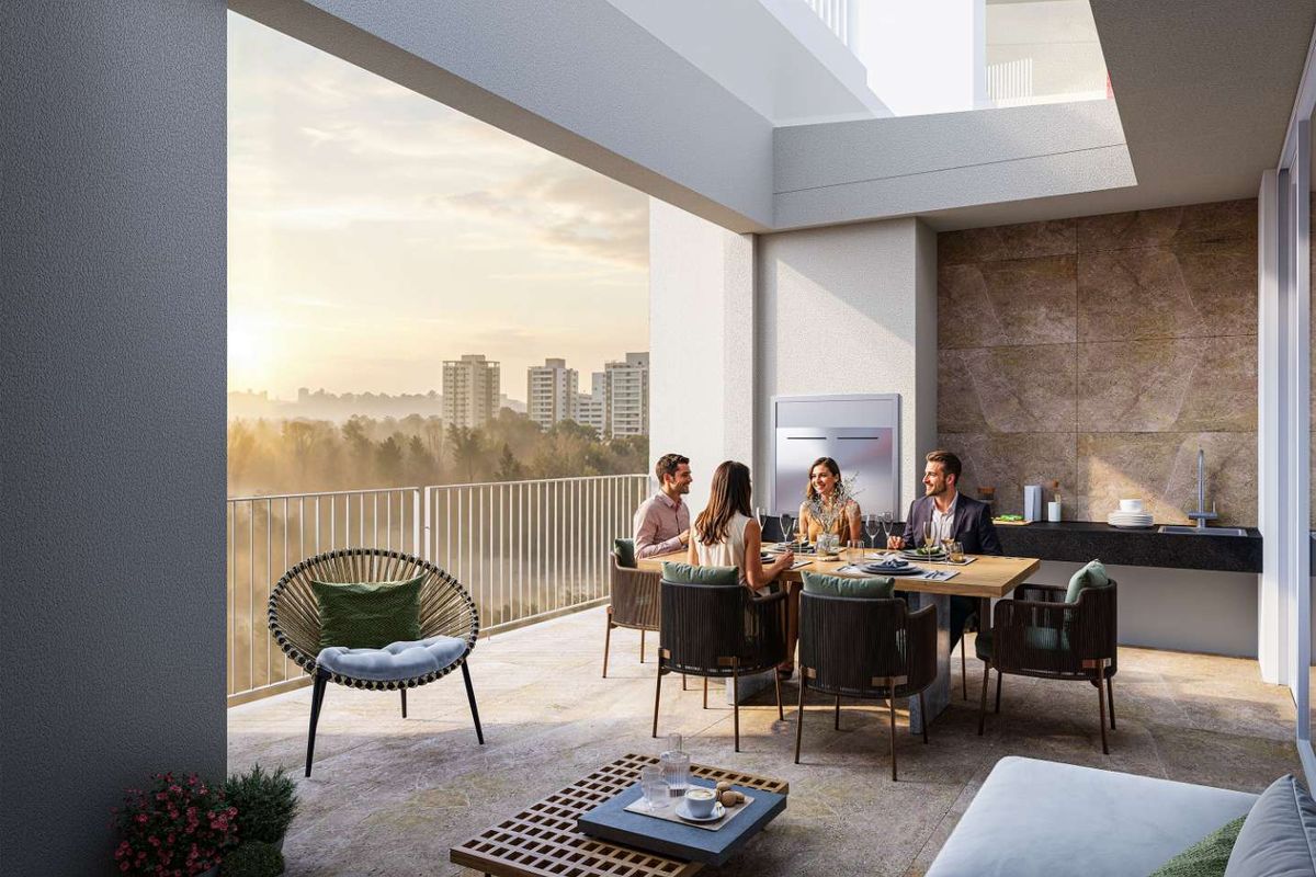 A spacious covered penthouse balcony featuring a built-in outdoor kitchen area, stone-tiled flooring, and panoramic city views.