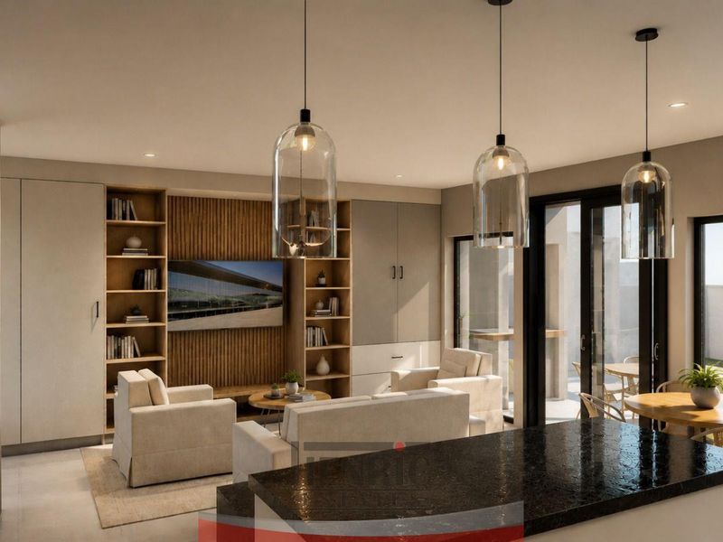 Modern open-plan living area featuring a stone kitchen island, custom built-in cabinetry with slatted wood accents, and seamless access to the outdoor patio.