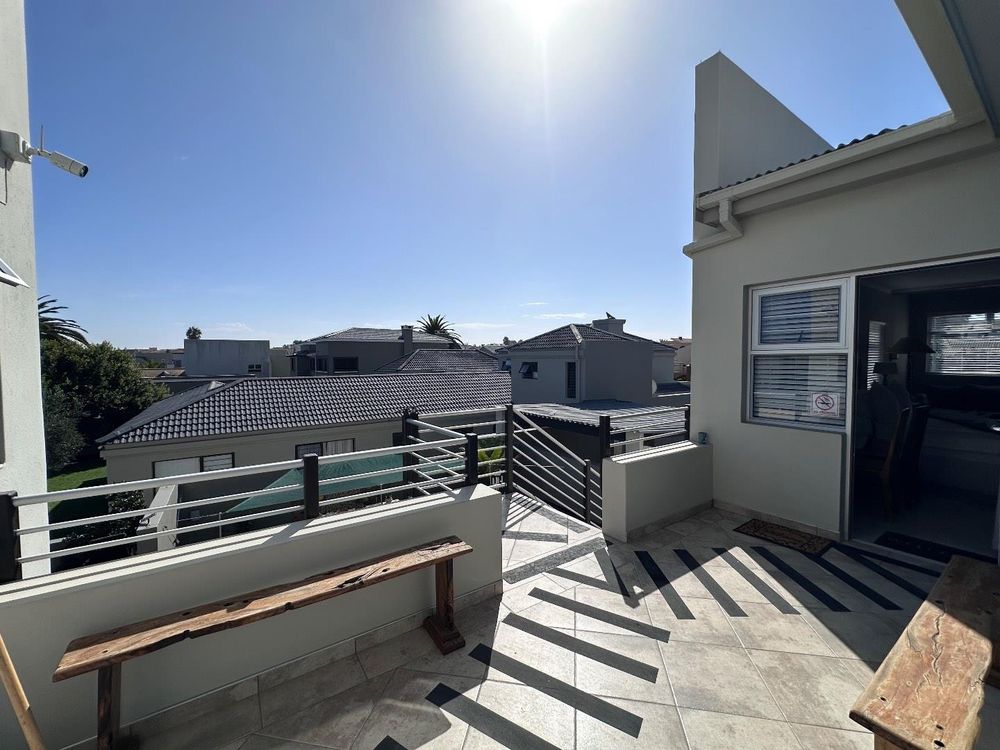 Back balcony  shared between the home and the two flatlets