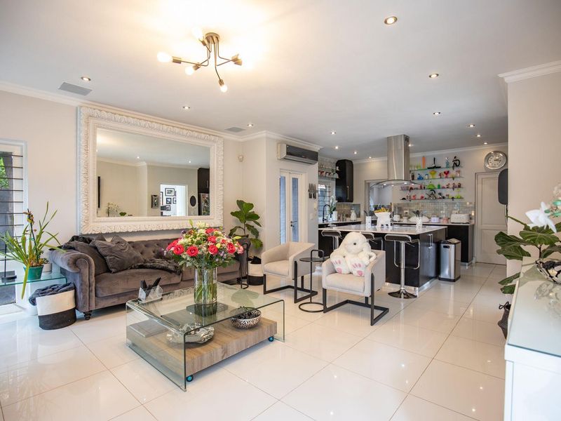 Elegant Four-Bedroom Home with Ample Space Available in Bryanston - Photo 9