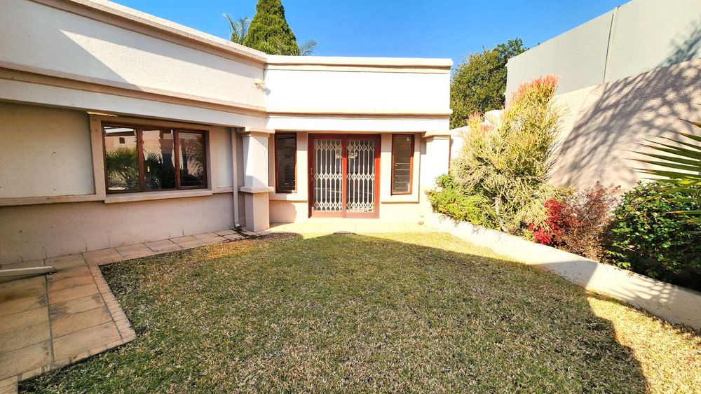 Garden view to master bedrooms sliding door entrance.