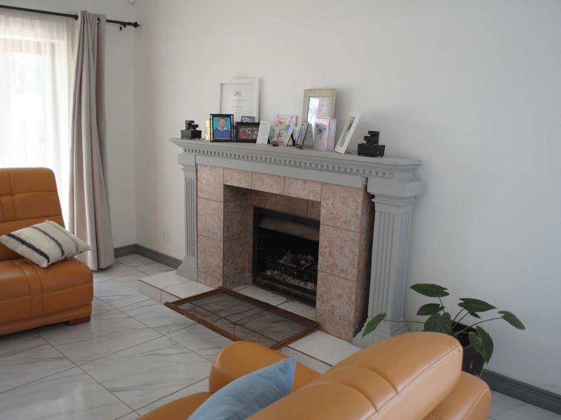 Renovated, built up, and expanded into a neat four-bedroom home with multiple living rooms and Bar area - Photo 3