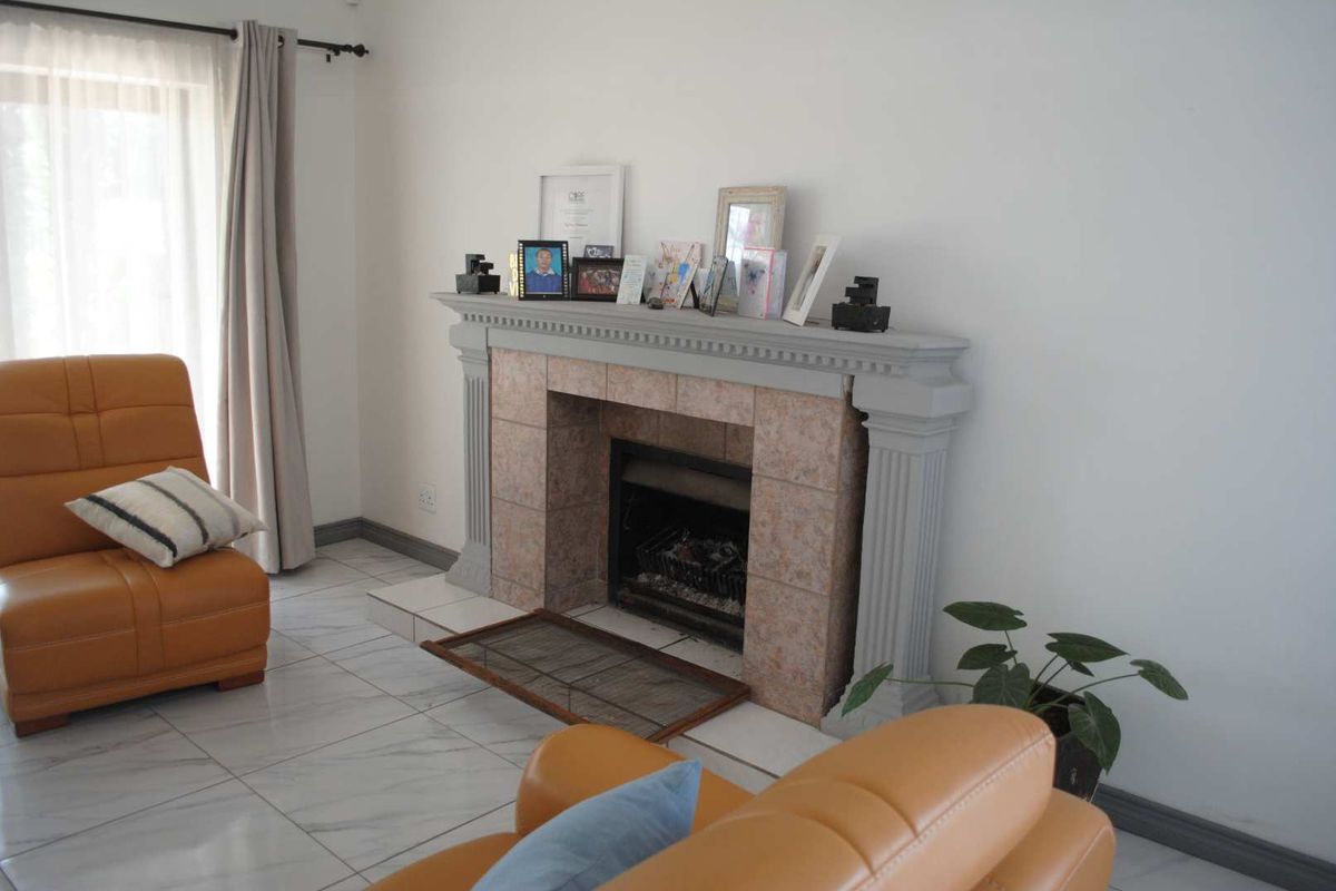 Renovated, built up, and expanded into a neat four-bedroom home with multiple living rooms and Bar area - Photo 3