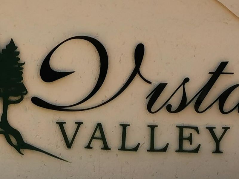 A close-up view of the Vista Valley signage, indicating the name of the residential complex or estate.