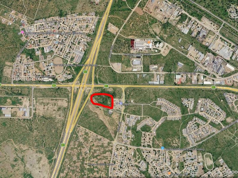 Aerial satellite view showing the location of the industrial property plot highlighted in red near the B1 highway intersection.