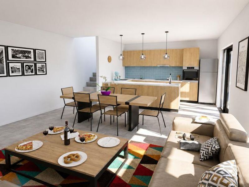 Modern open-plan living and dining area featuring a contemporary kitchen with wood-finish cabinetry, integrated appliances, and large sliding doors leading to the outdoors.