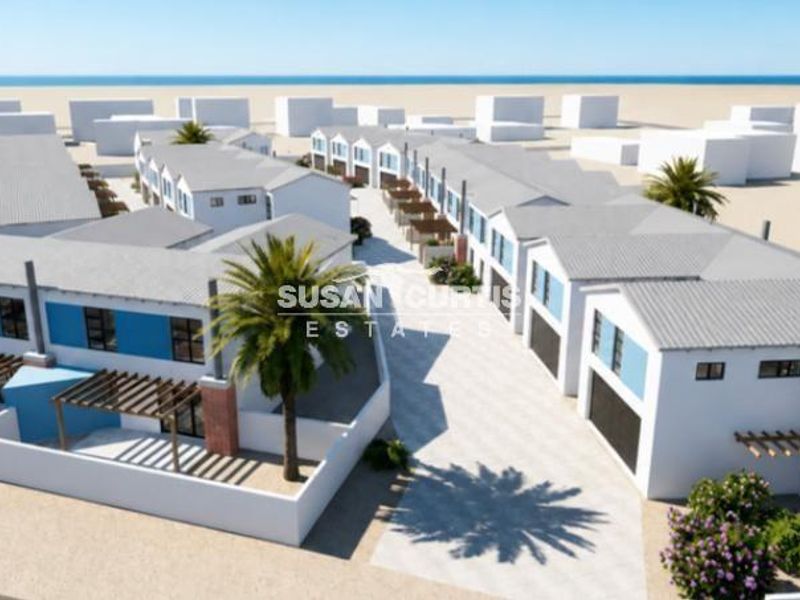 An aerial 3D render of a townhouse complex featuring multiple units with pitched roofs, private pergolas, and paved driveways.