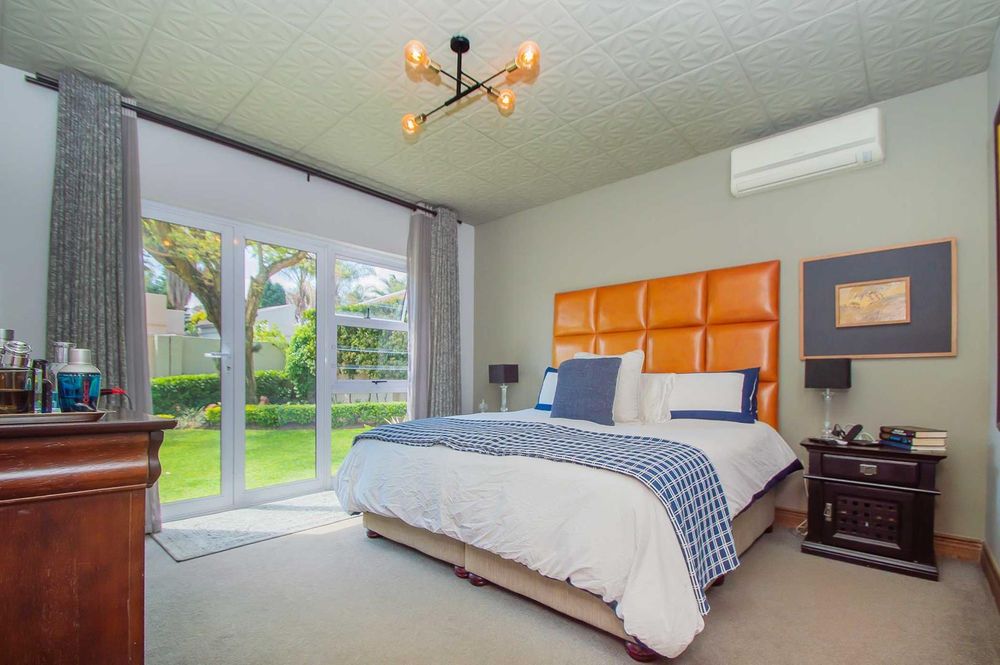 Main bedroom with sliders to garden