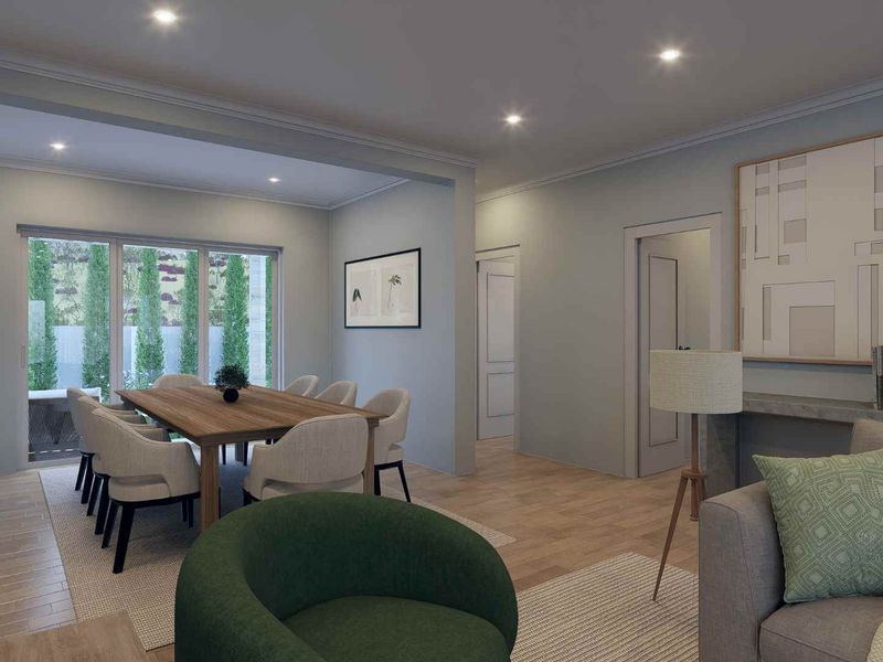 Spacious open-plan living and dining area featuring timber flooring, recessed downlighting, and large sliding glass doors providing access to the outdoor space.