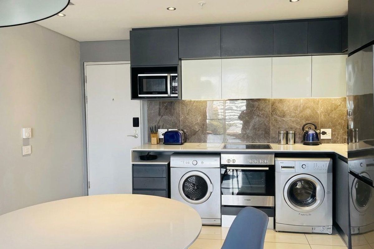 FULLY FURNISHED APARTMENT AT THE CAPITAL AVAILABLE - Photo 2