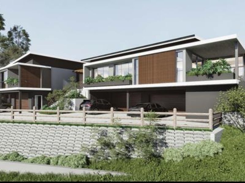 A modern architectural rendering of a multi-level residential property featuring contemporary facade design, integrated garages, and elevated balcony spaces.