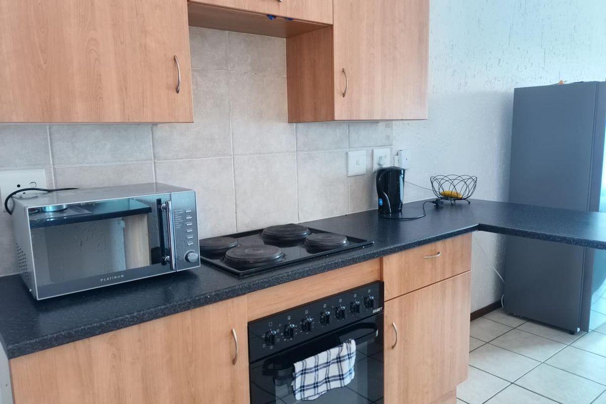 2 bed 2nd floor unit in 24h security complex, close to East rand Mall - Photo 2
