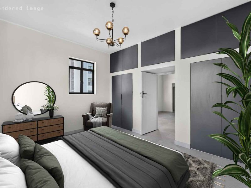 A modern bedroom featuring extensive built-in cupboards, tiled flooring, and a contemporary ceiling light fixture.