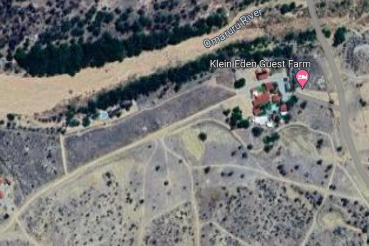 Aerial view of the small holding property situated along the Omaruru River, showing the main guest farm buildings and surrounding landscape.