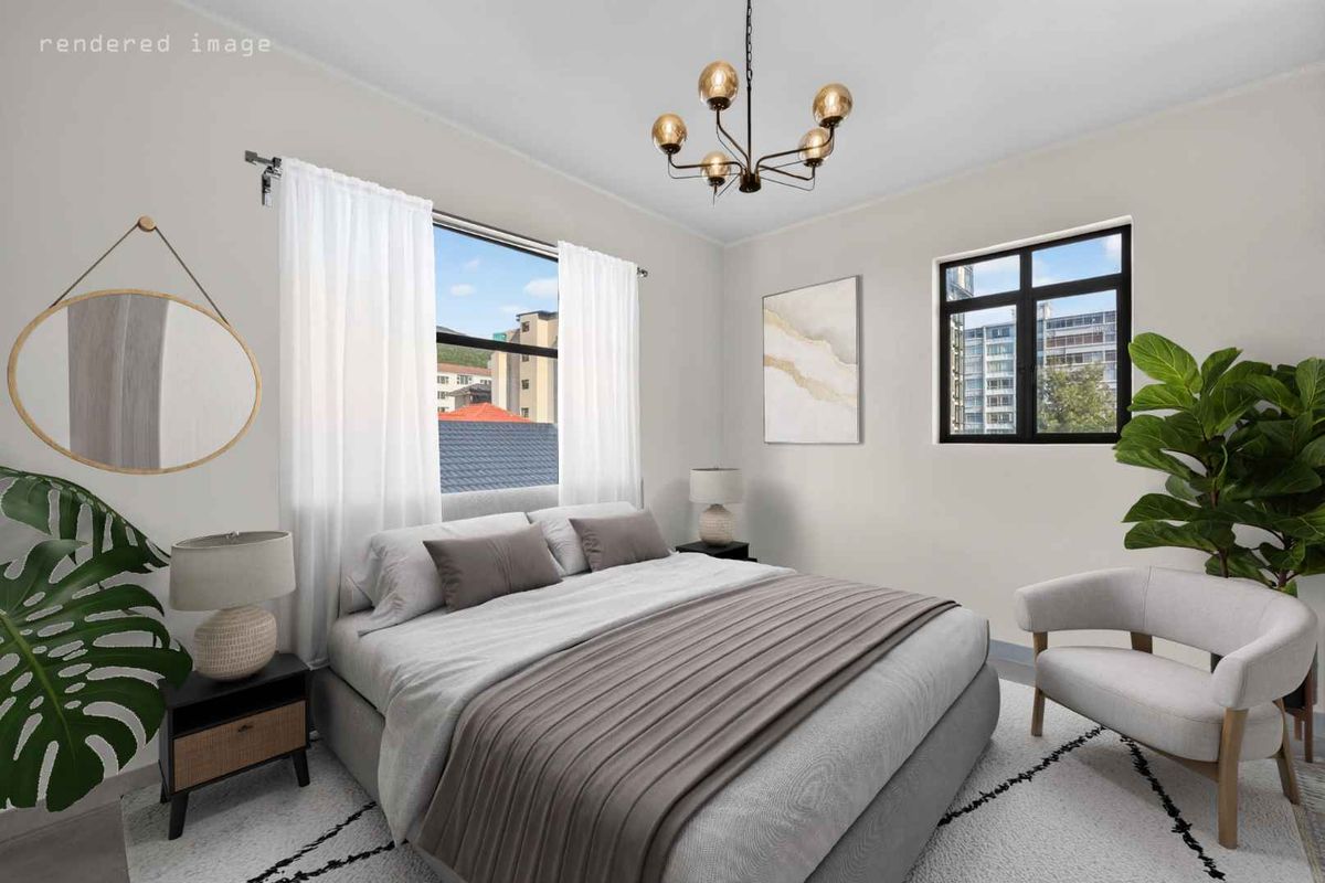 A bright and modern bedroom featuring large casement windows and a contemporary chandelier, offering a clean and well-maintained living space.