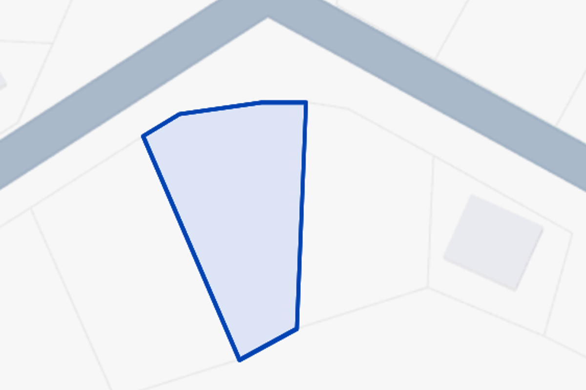 A digital map view highlighting the boundaries of the vacant residential land plot.