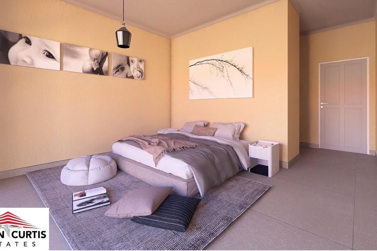 A well-lit bedroom featuring neutral wall tones, tiled flooring, and a modern pendant light fixture.