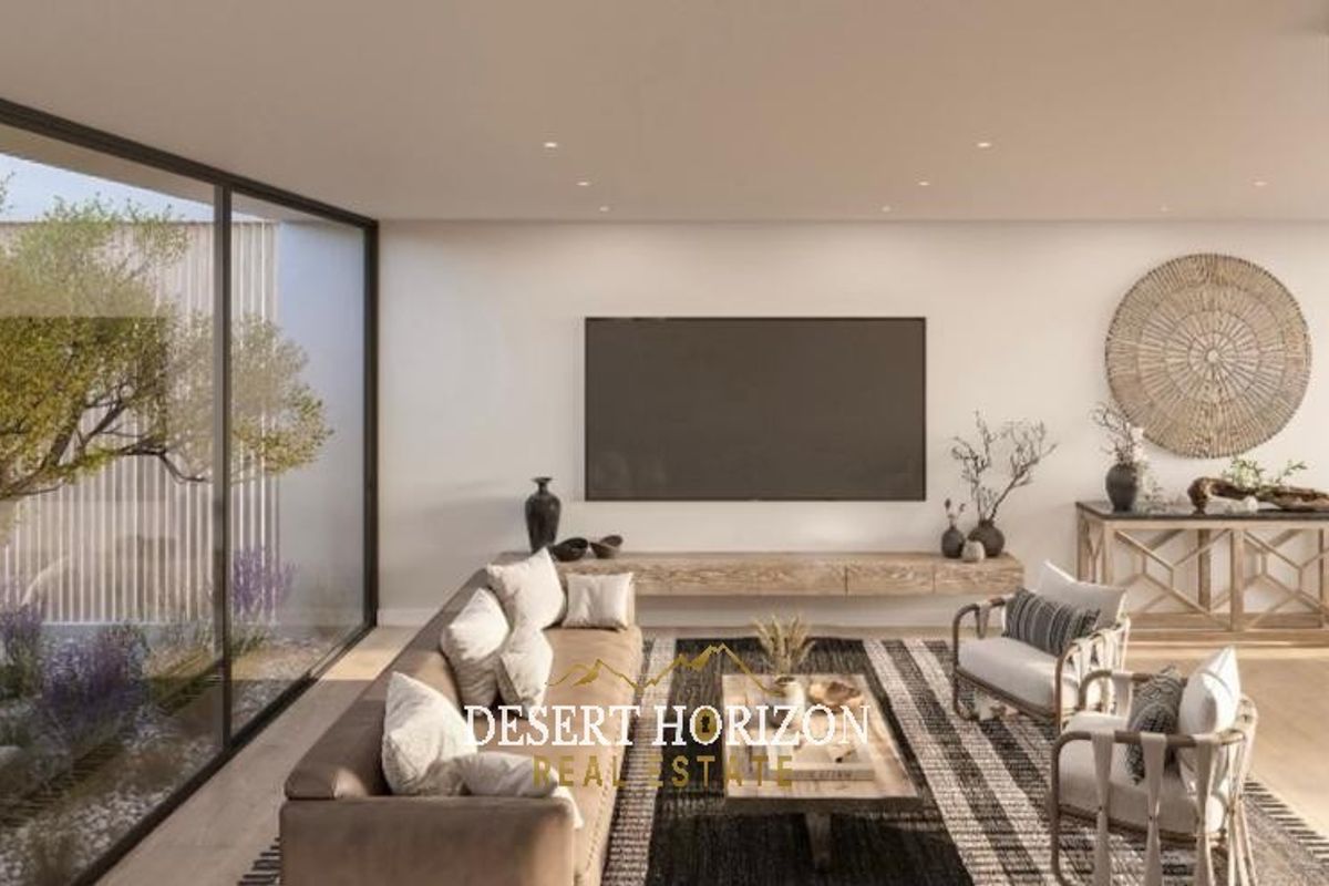 Modern open-plan living area featuring floor-to-ceiling windows, recessed lighting, and a sleek floating media console, seamlessly connecting to the dining space.