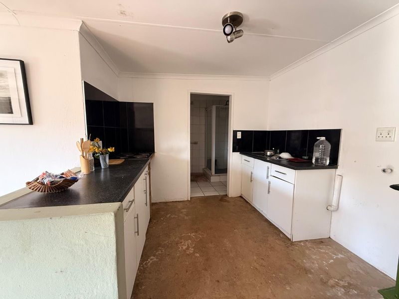 Charming 2-Bed Home with Two Bonus Units for Extra Income - Photo 8