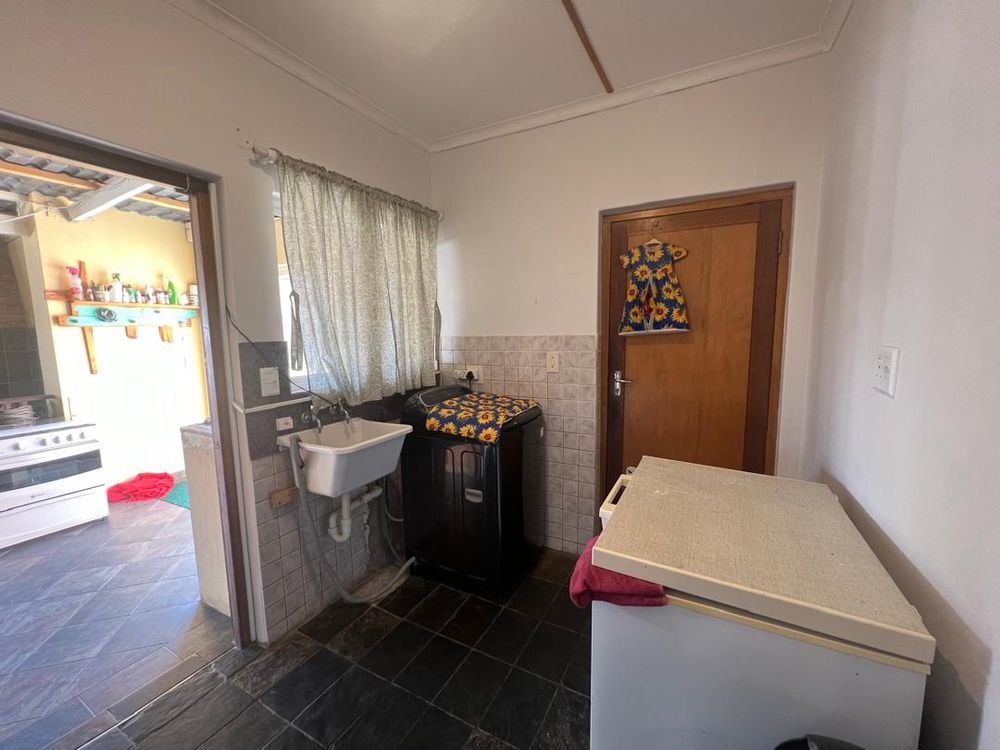Door on left leads to entertainment area and the door on the right goes to the garage