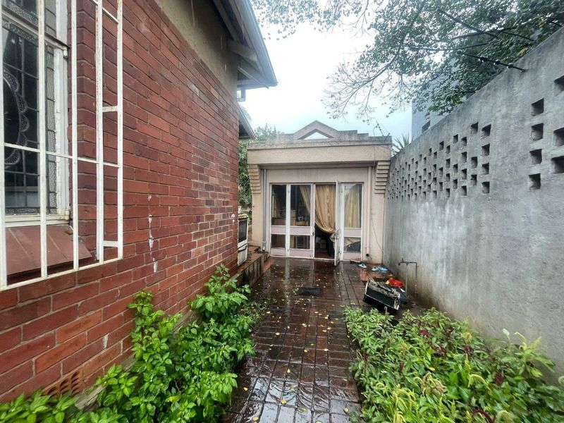 Triple Cottage Gem: Renovate, Invest, and Prosper! - Photo 1