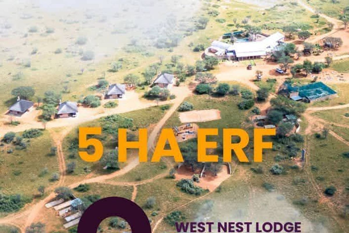 Aerial view of a 5-hectare residential erf featuring multiple detached lodge-style buildings set within a natural landscape.