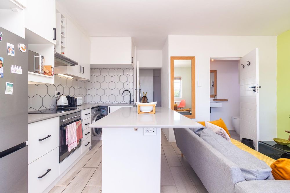 Lounge to kitchen ( bedroom is the left door and the bathroom is the right door)