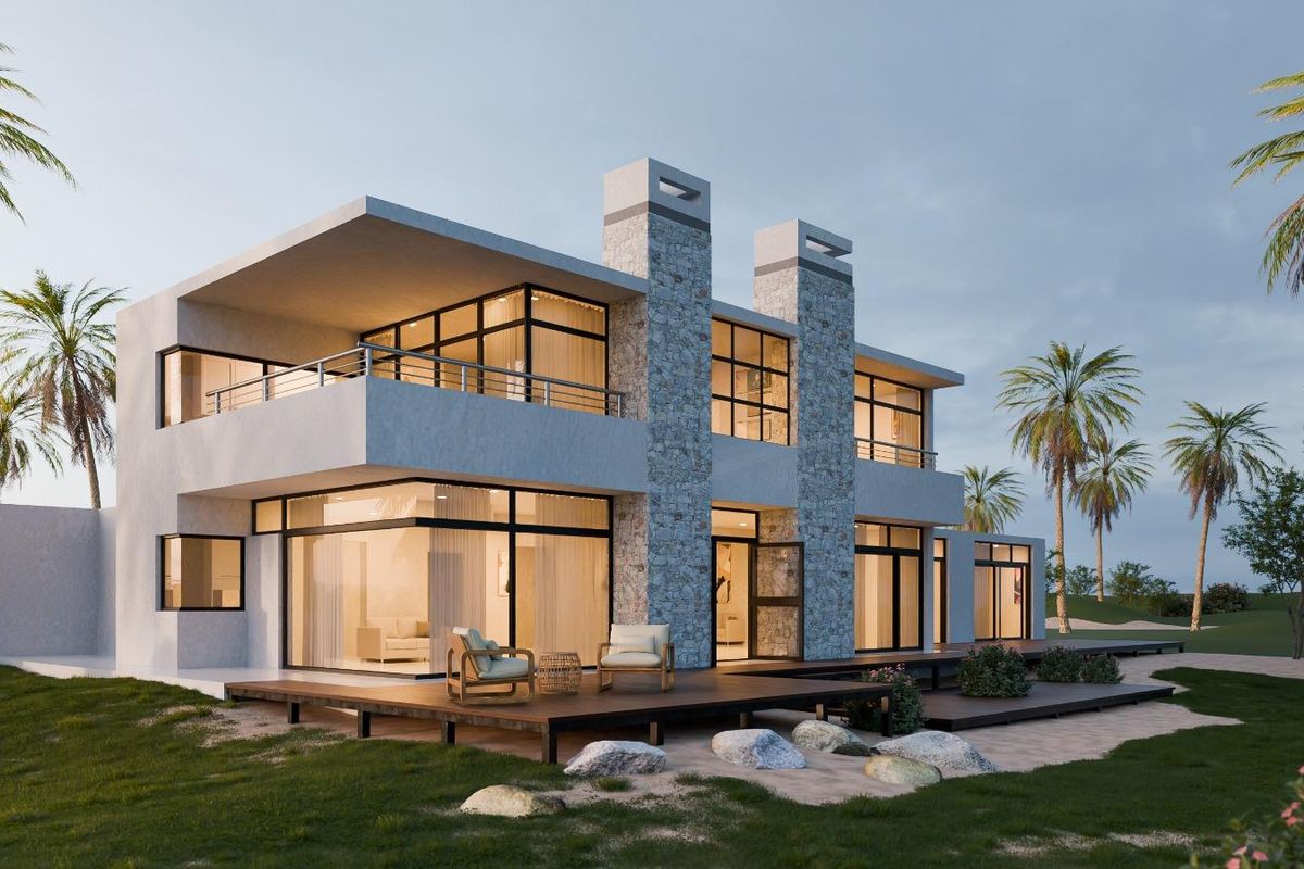 A modern two-story residential property featuring stone chimneys, expansive glass sliding doors, and a spacious timber deck overlooking a landscaped garden.